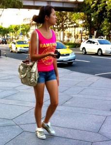 My guess is that she is not Taiwanese. I'm going by the loud colors and her appreciation of of the sun (sun tan).